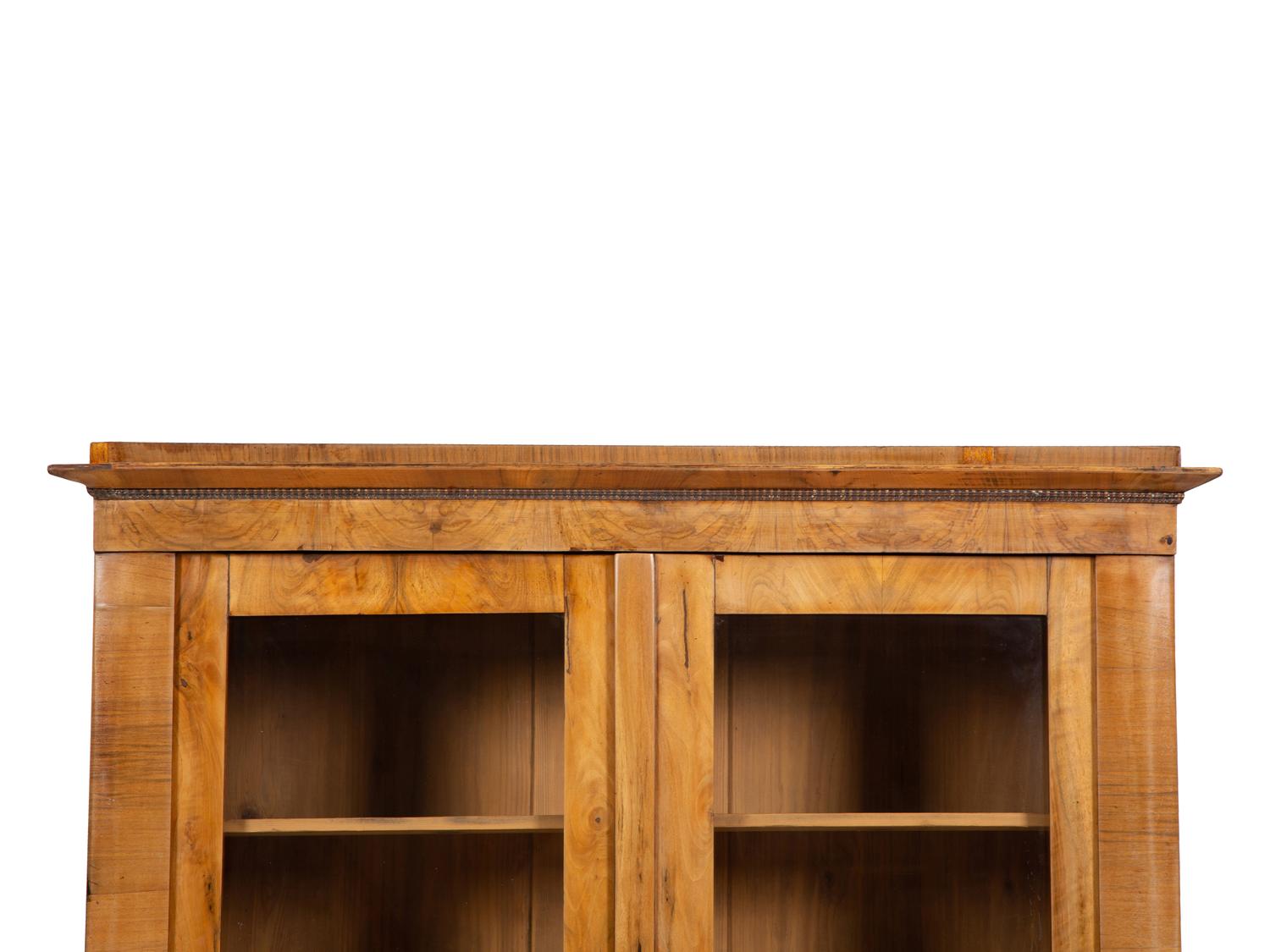A Pair of Biedermeier Figured Birch Bookcases