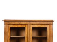 A Pair of Biedermeier Figured Birch Bookcases