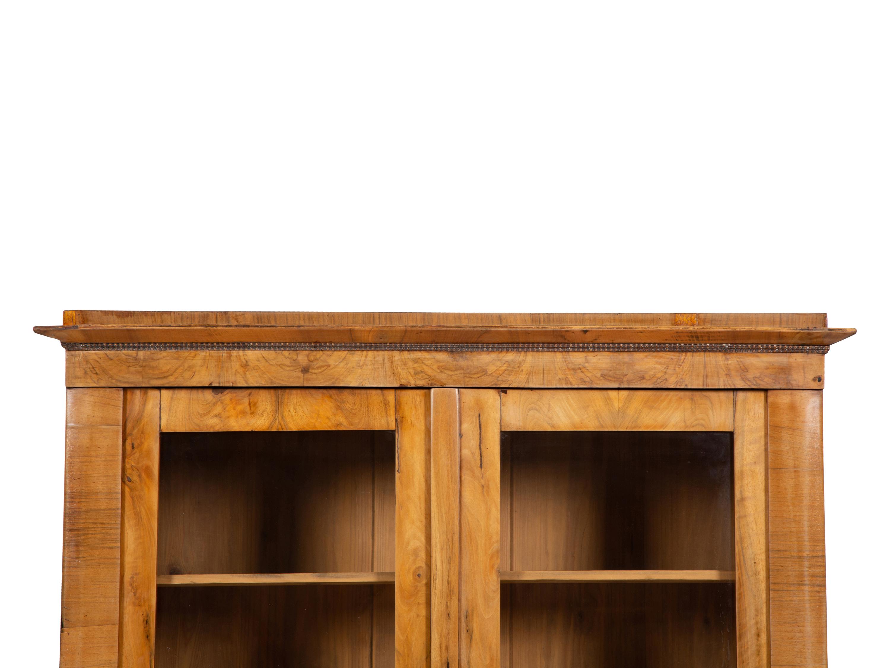 A Pair of Biedermeier Figured Birch Bookcases