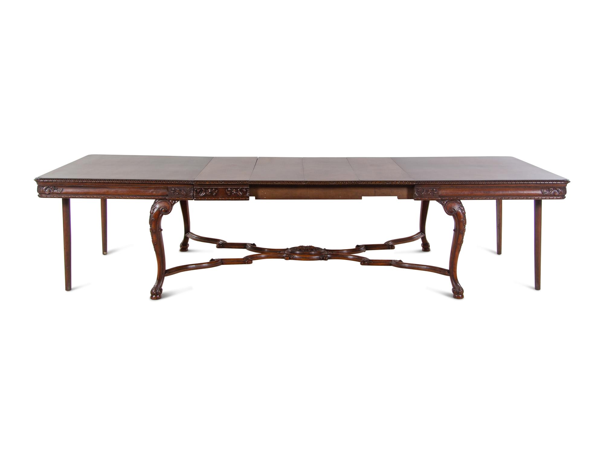 A George II Style Walnut Dining Table