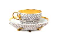 A German Porcelain Schneeballen Cup and Saucer, Diameter of saucer 5 1/4 inches.