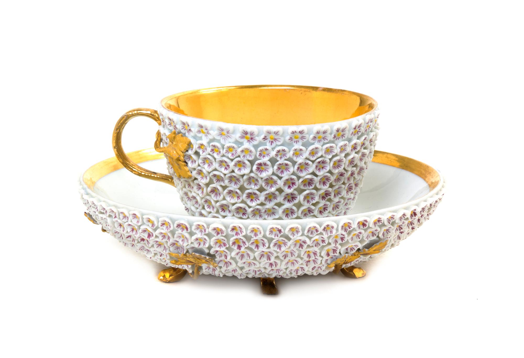 A German Porcelain Schneeballen Cup and Saucer, Diameter of saucer 5 1/4 inches.