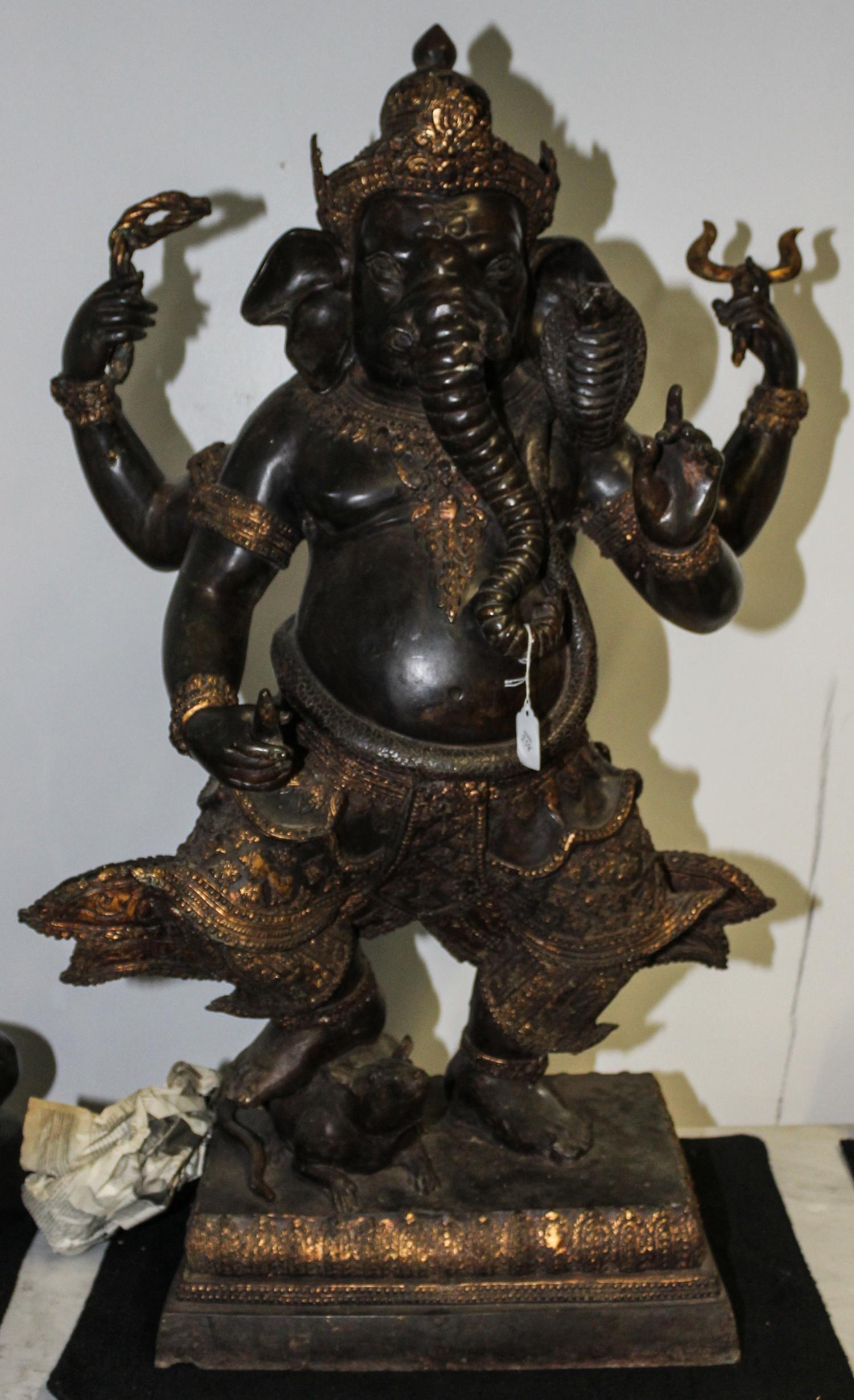 An Indian Bronze Ganesha Stepping on a Rat. Height 38 1/2 inches.