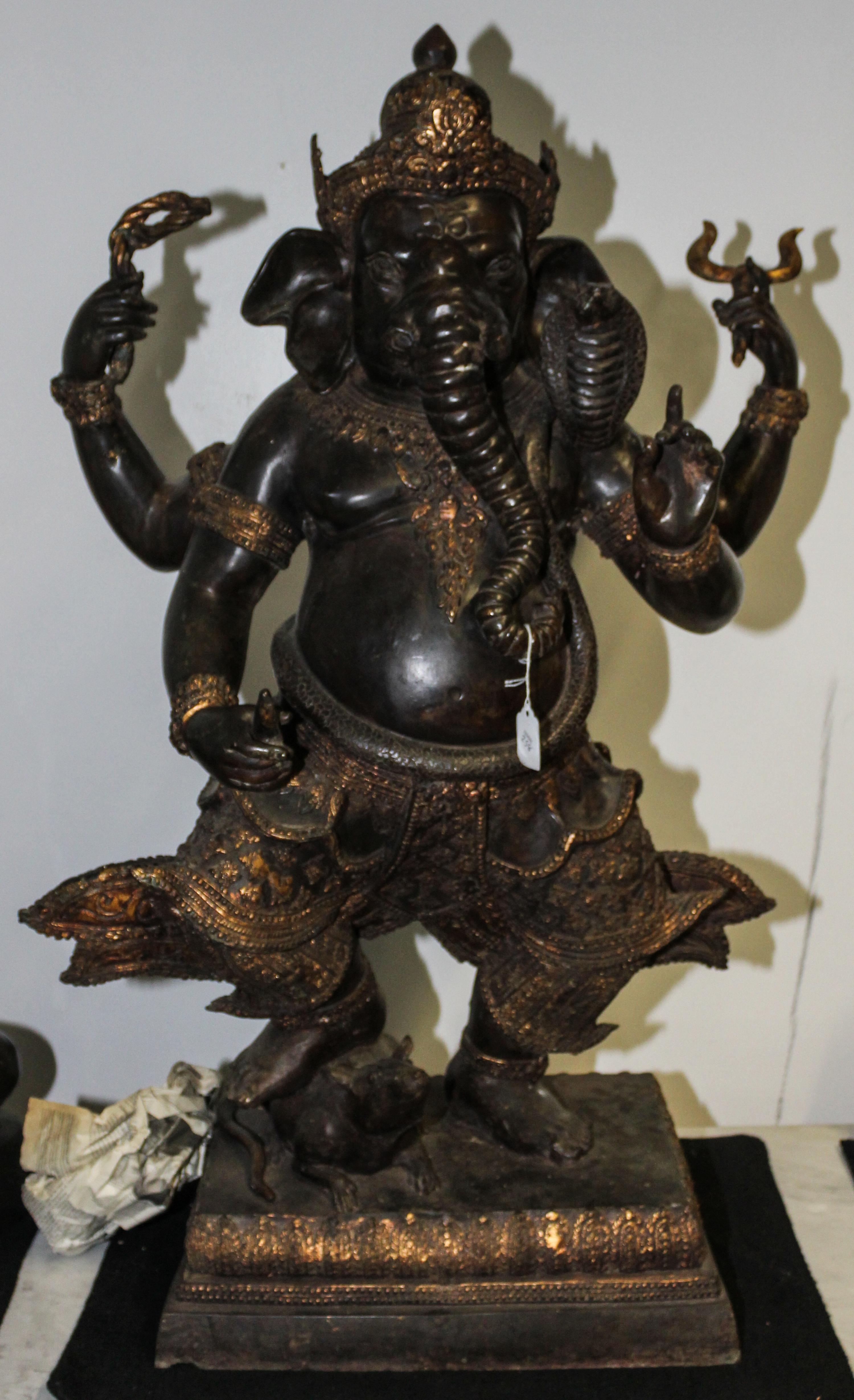An Indian Bronze Ganesha Stepping on a Rat. Height 38 1/2 inches.