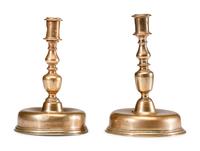 A Near Pair of Dutch William and Mary Brass Bell-Bottom Candlesticks