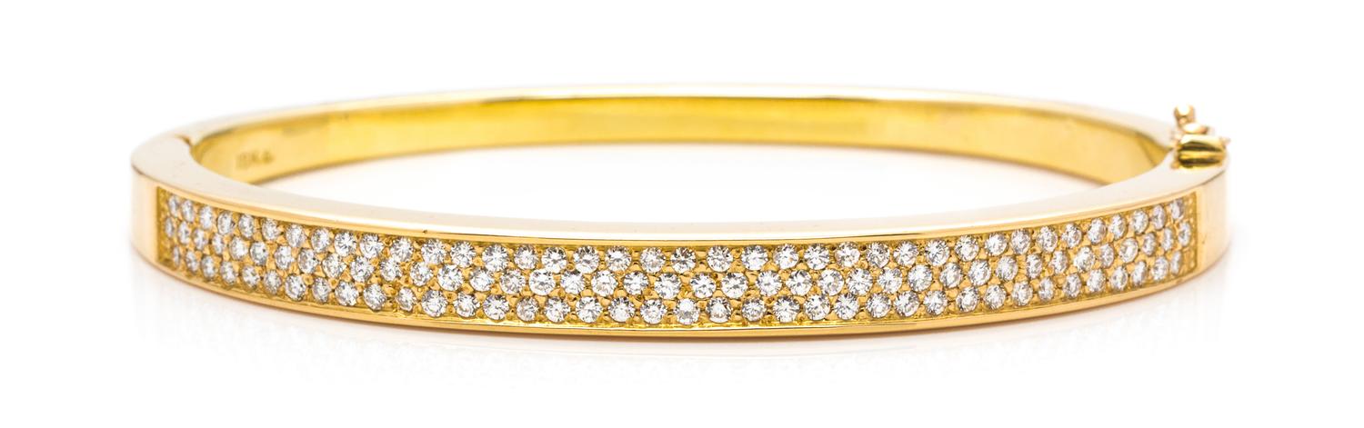 An 18 Karat Yellow Gold and Diamond Bangle Bracelet, 18.50 dwts.