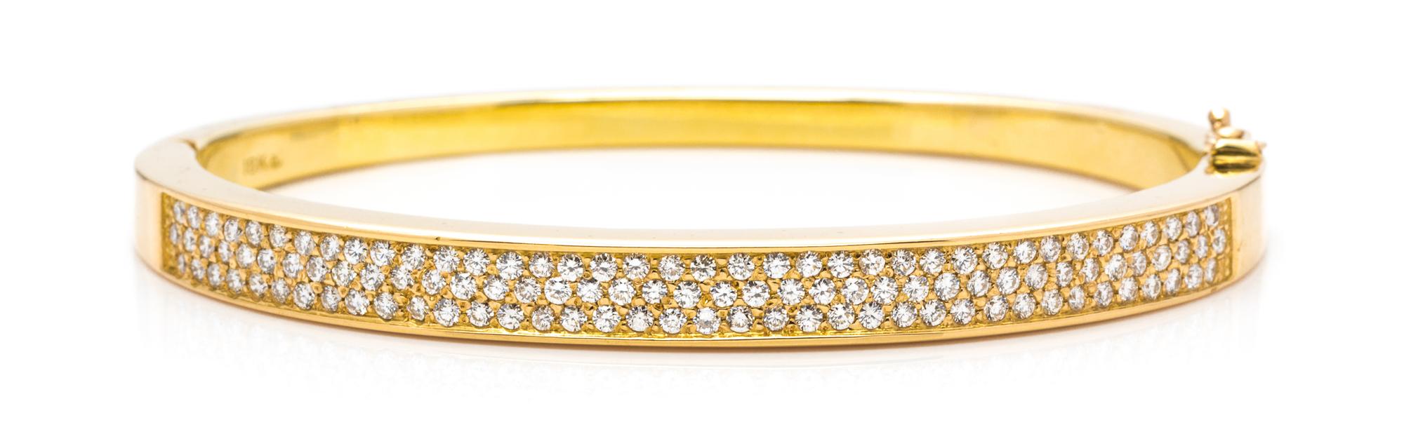 An 18 Karat Yellow Gold and Diamond Bangle Bracelet, 18.50 dwts.