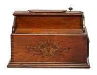 A Monitor Paint Decorated Oak and Cast Iron Coin-Operated Barbershop Cash Register