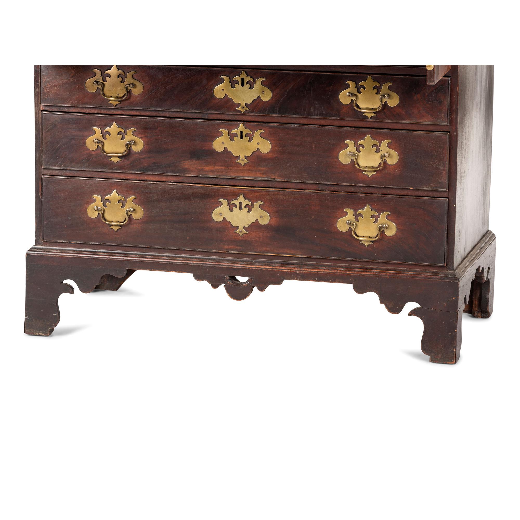 A Chippendale Carved and Figured Mahogany Slant-Front Desk