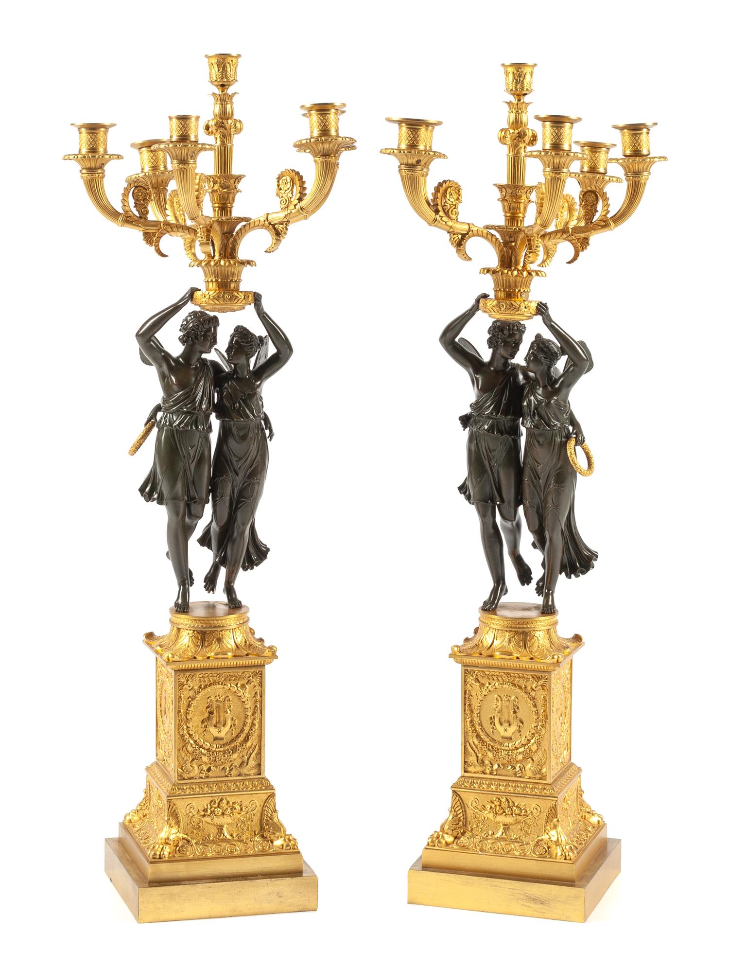 A Pair of Empire Style Gilt and Patinated Bronze Candelabra Height 38 inches. — 20TH CENTURY