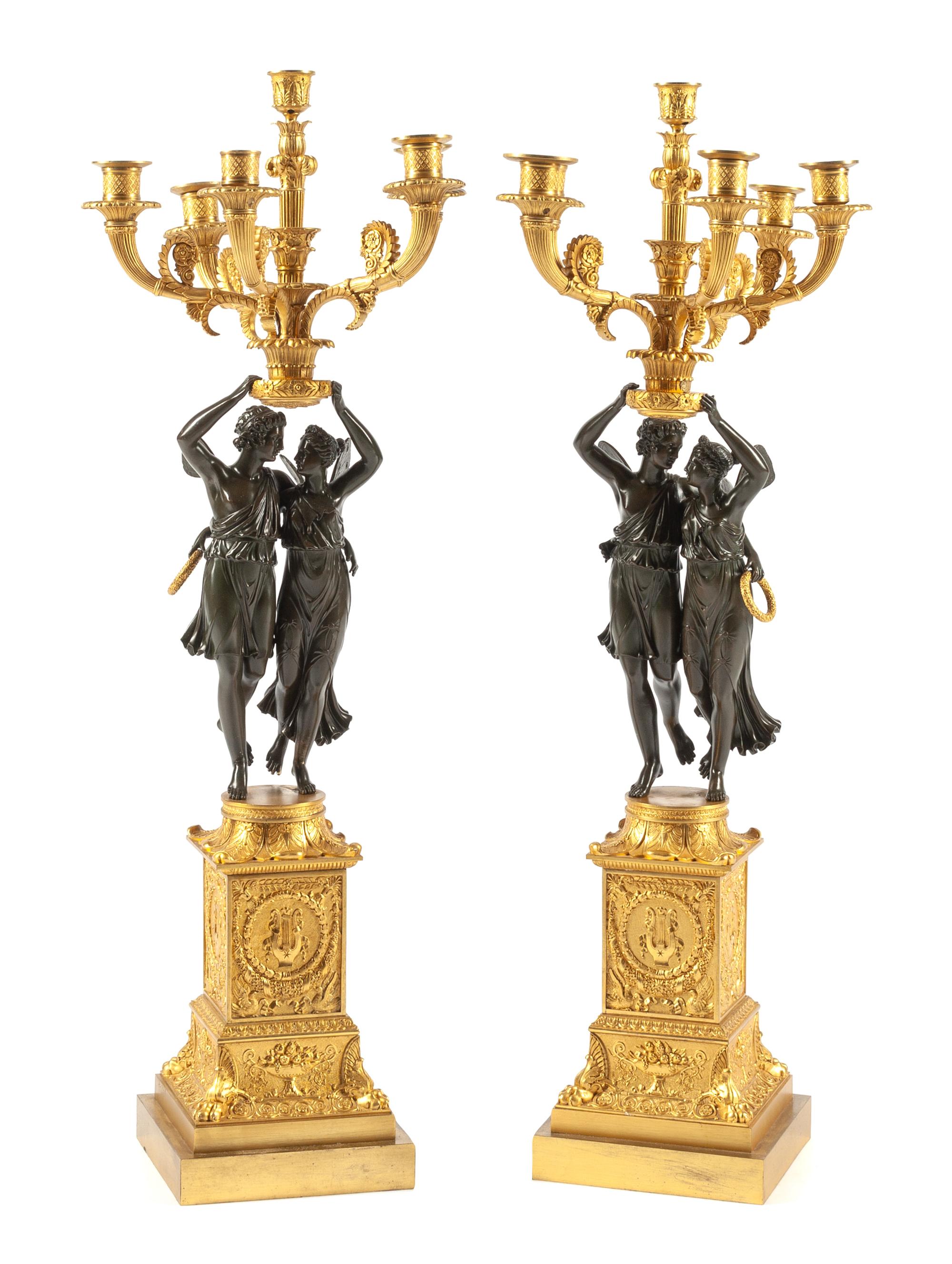 A Pair of Empire Style Gilt and Patinated Bronze Candelabra Height 38 inches. — 20TH CENTURY