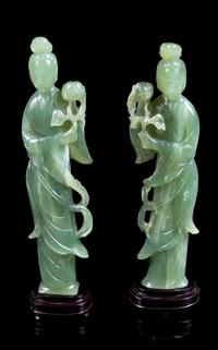 A Pair of Chinese Carved Green Hardstone Figures of Female Immortals Height of figure 11 inches. — 20TH CENTURY