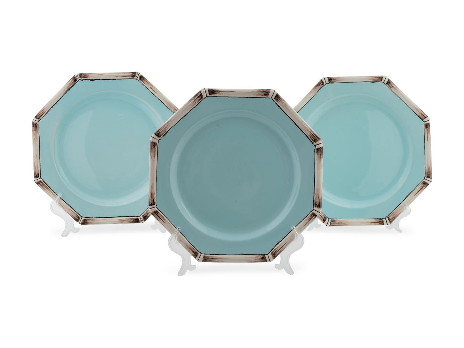 A Set of Thirteen Italian Ceramic Pale Blue and Bamboo Bordered Dinner Plates