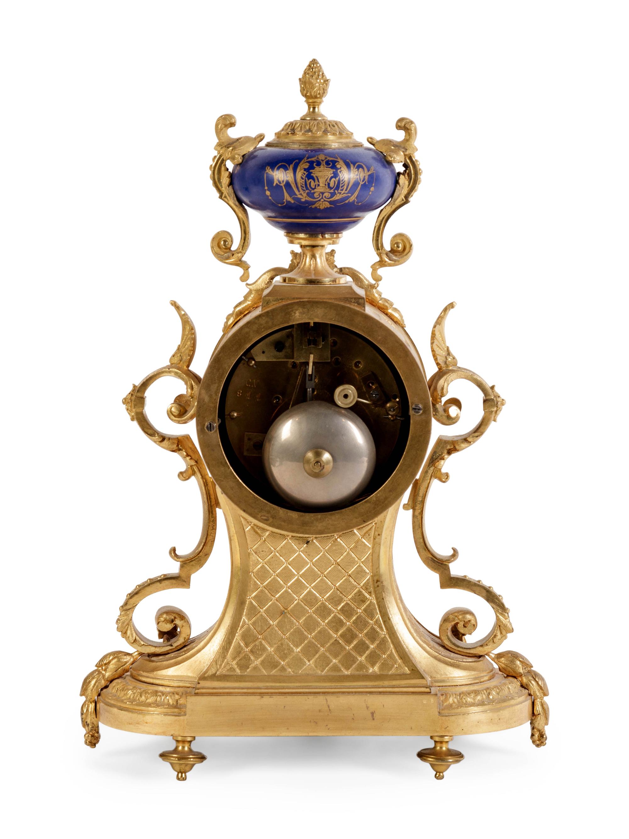 A Louis XVI Style Porcelain Inset Gilt Bronze Mantel Clock