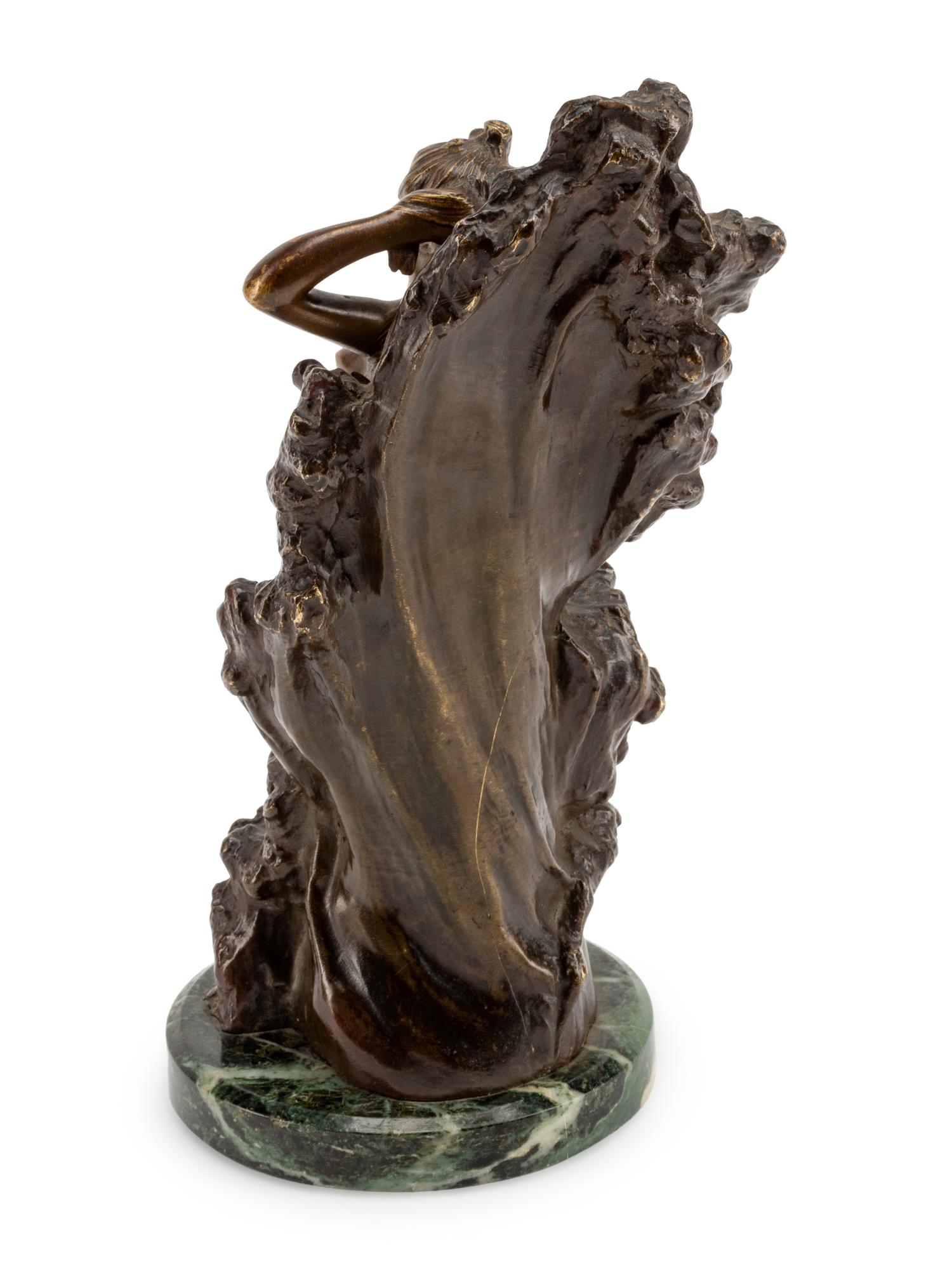 A Continental Gilt and Patinated Bronze Figure of a Nude Against Waves