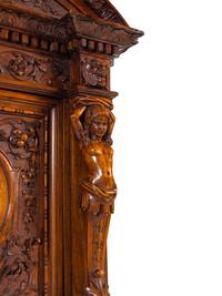 A Renaissance Revival Carved Walnut Cabinet on Stand