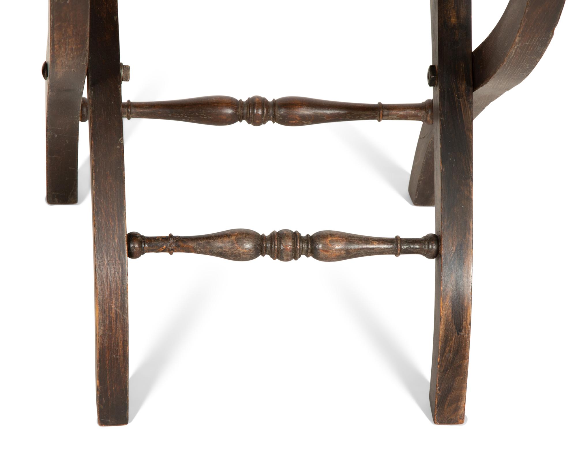 A Pair of Continental Carved Oak 'Gothic' Folding Chairs