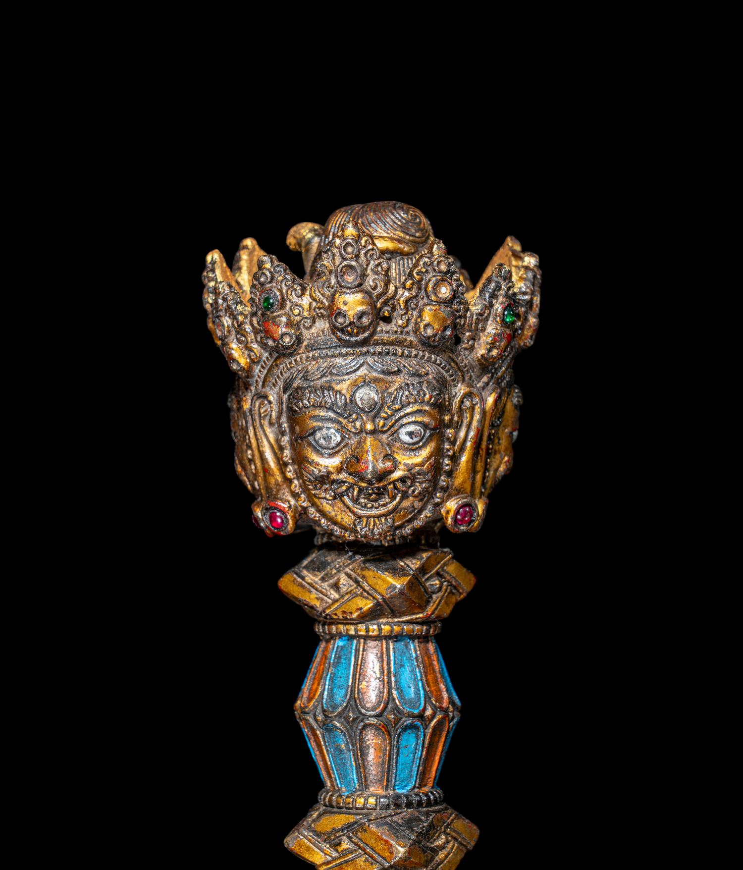 A Tibetan Gilt and Painted Bronze Vajra