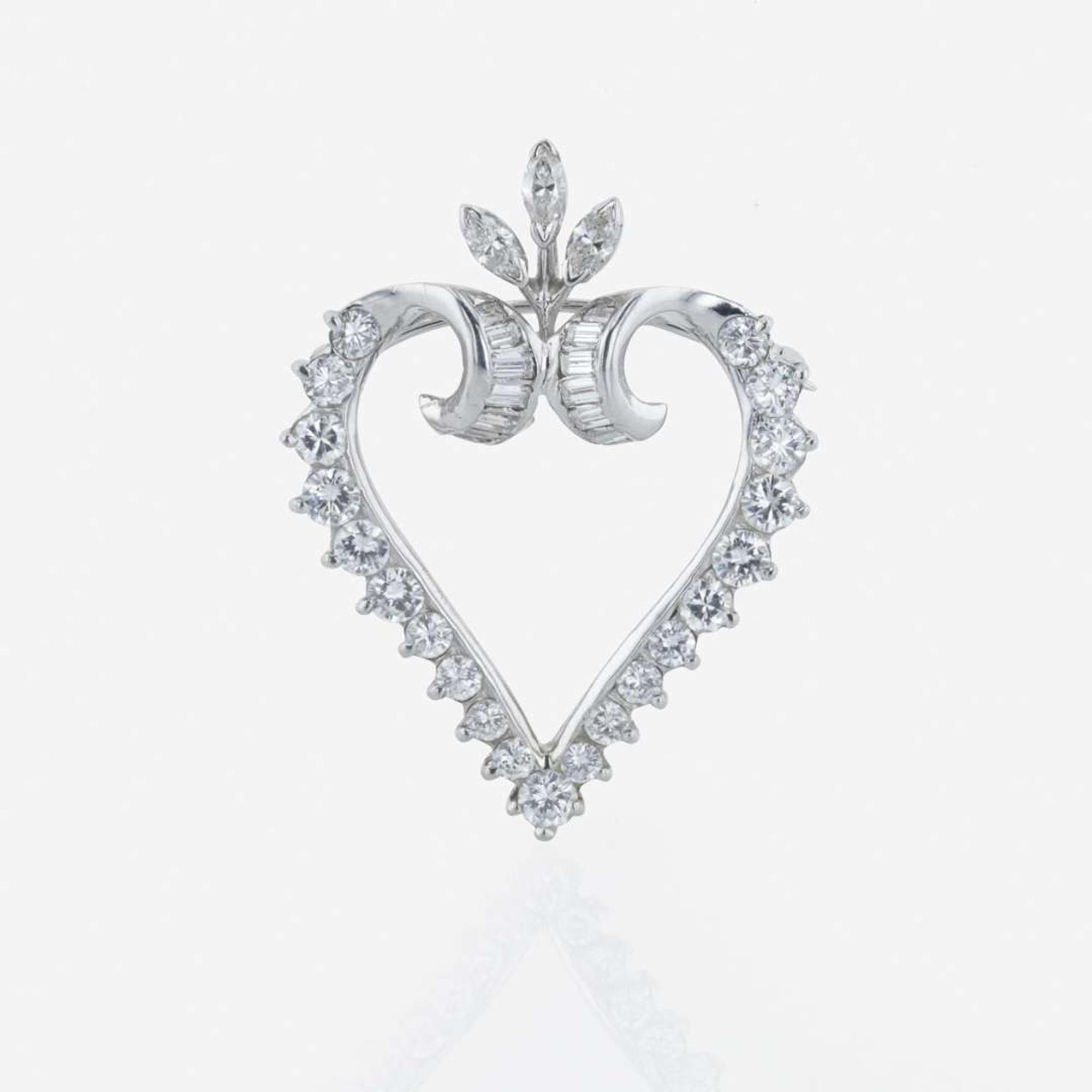 A platinum and diamond pendant/brooch