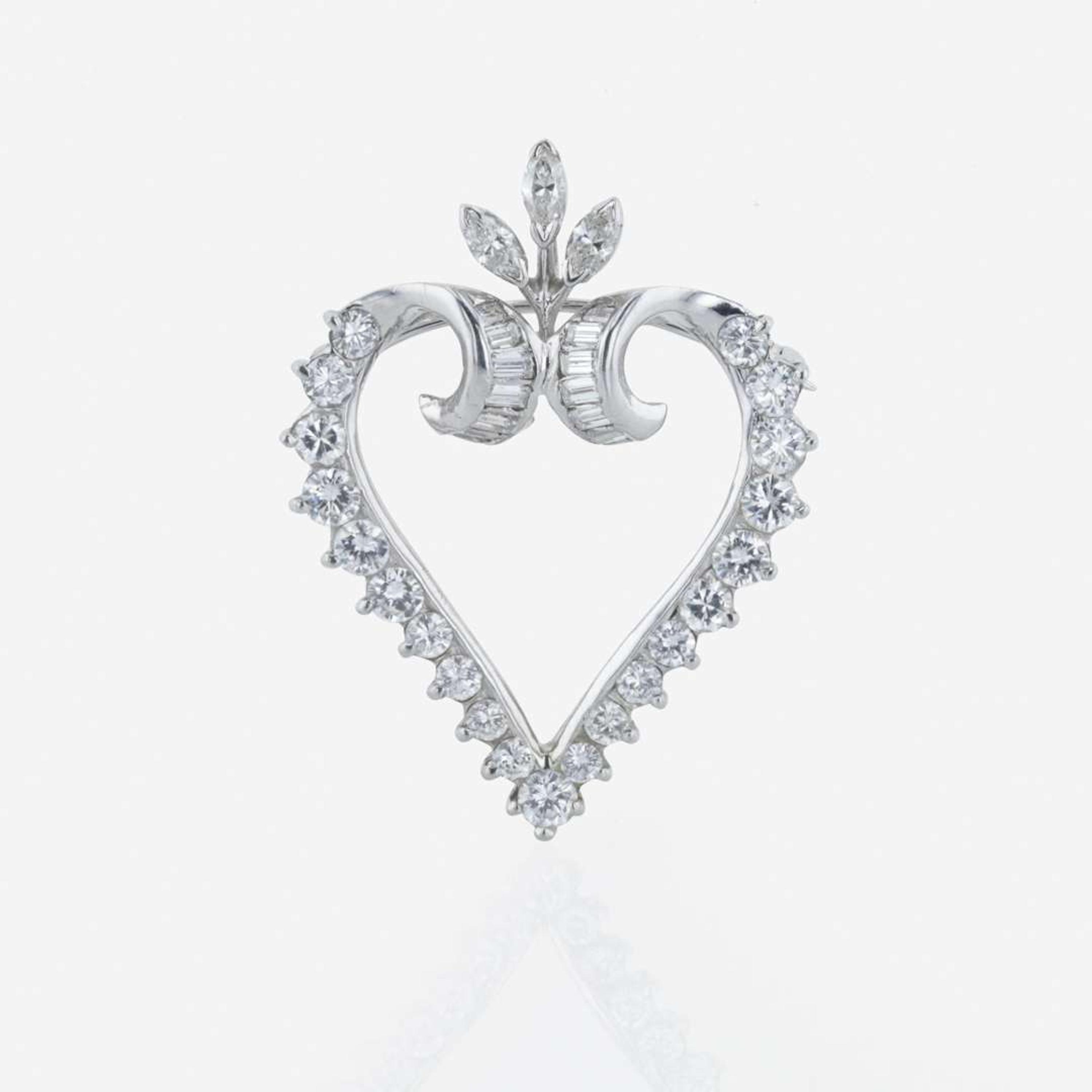A platinum and diamond pendant/brooch