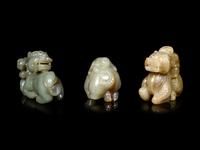 Three Chinese Celadon Jade Figures of Boys