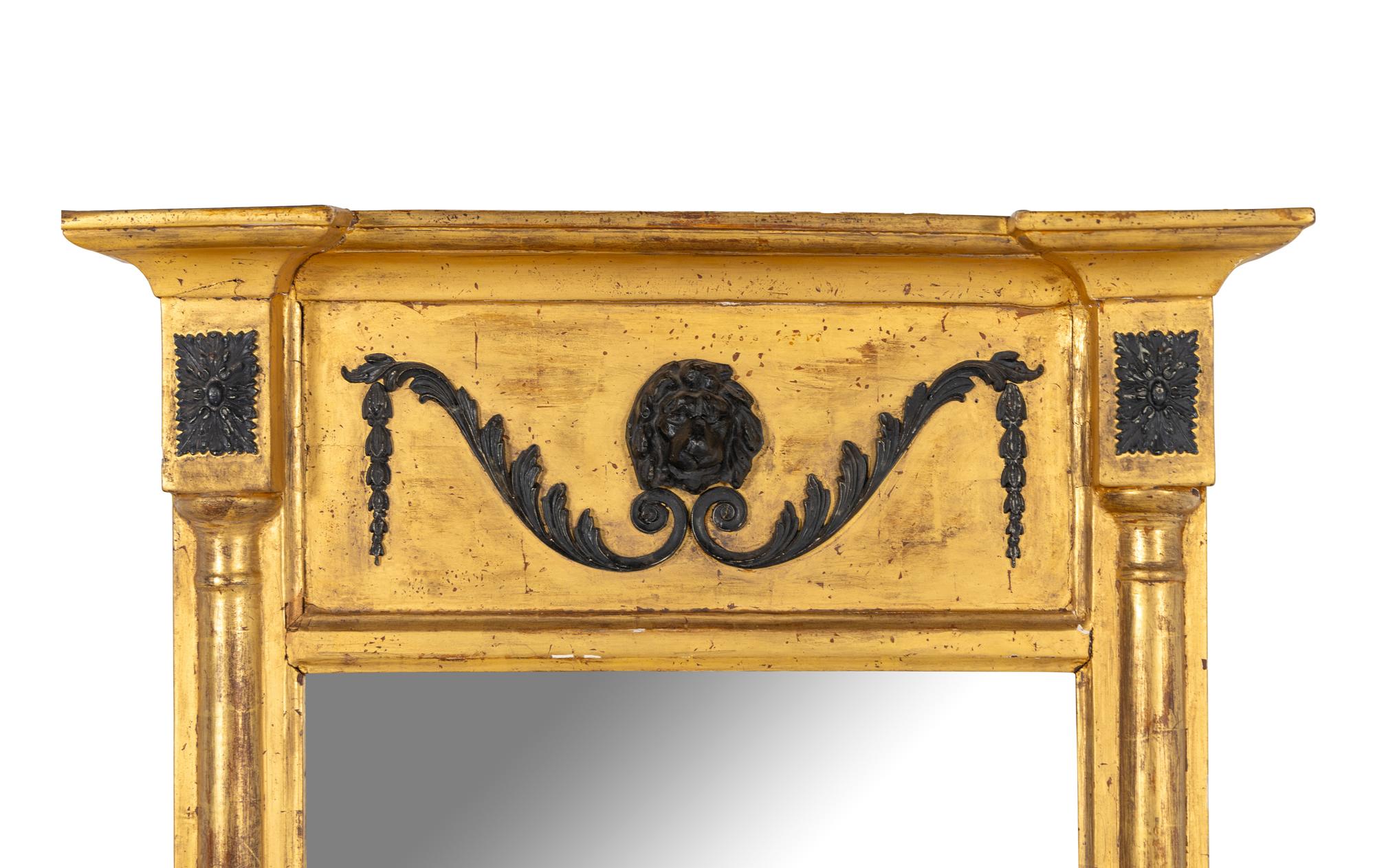 A Regency Part Ebonized Giltwood Mirror