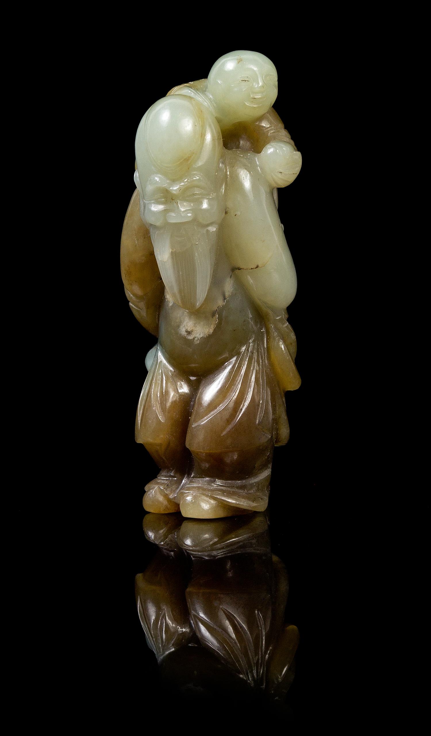 A Chinese Celadon Jade Figural Group of Shoulao and Child 18TH/19TH CENTURY Height 3 1/4 x width 1 5/8 inches. — 18TH/19TH CENTURY