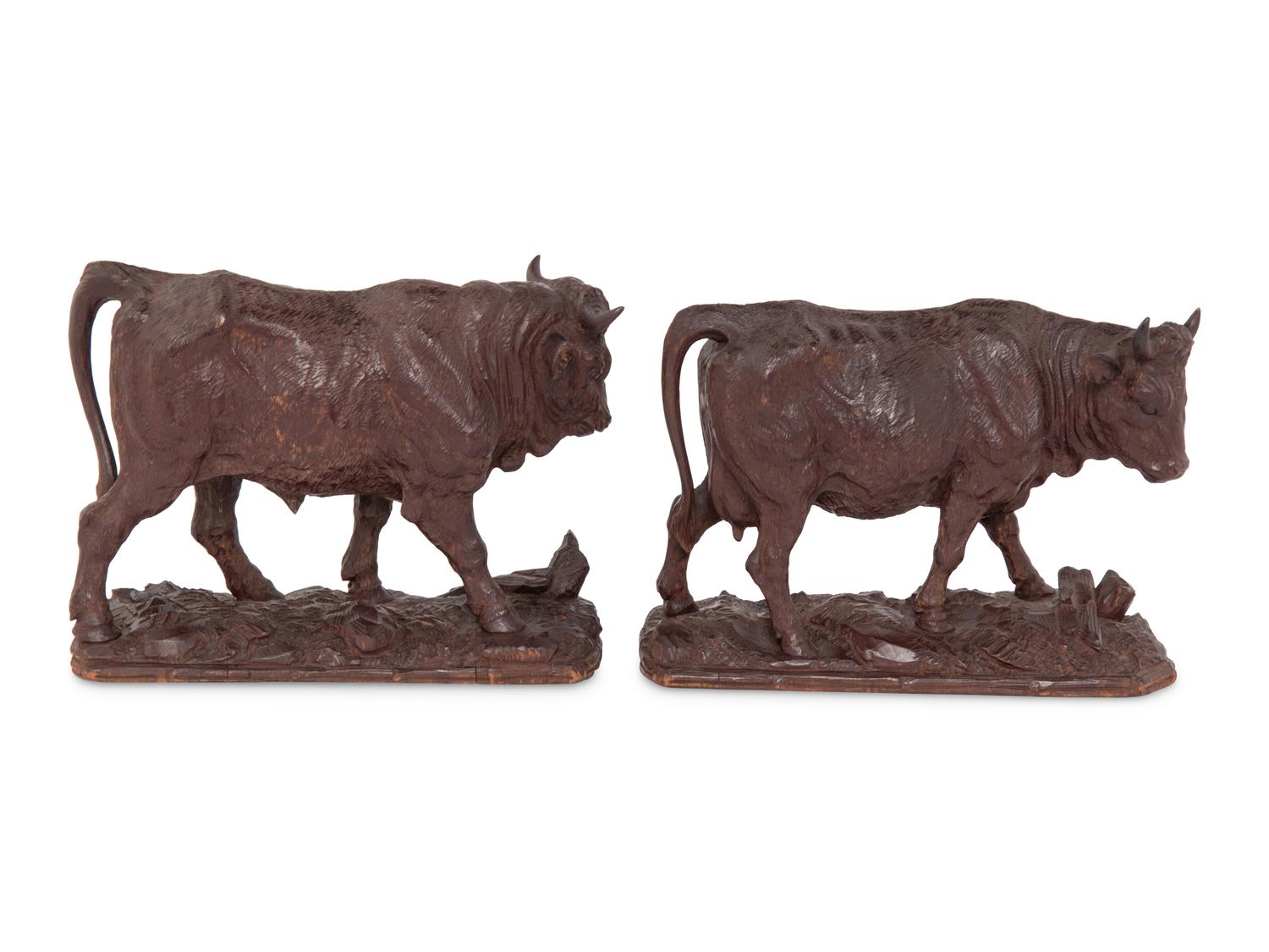 A Pair of Swiss Carved Wood Models of Cattle