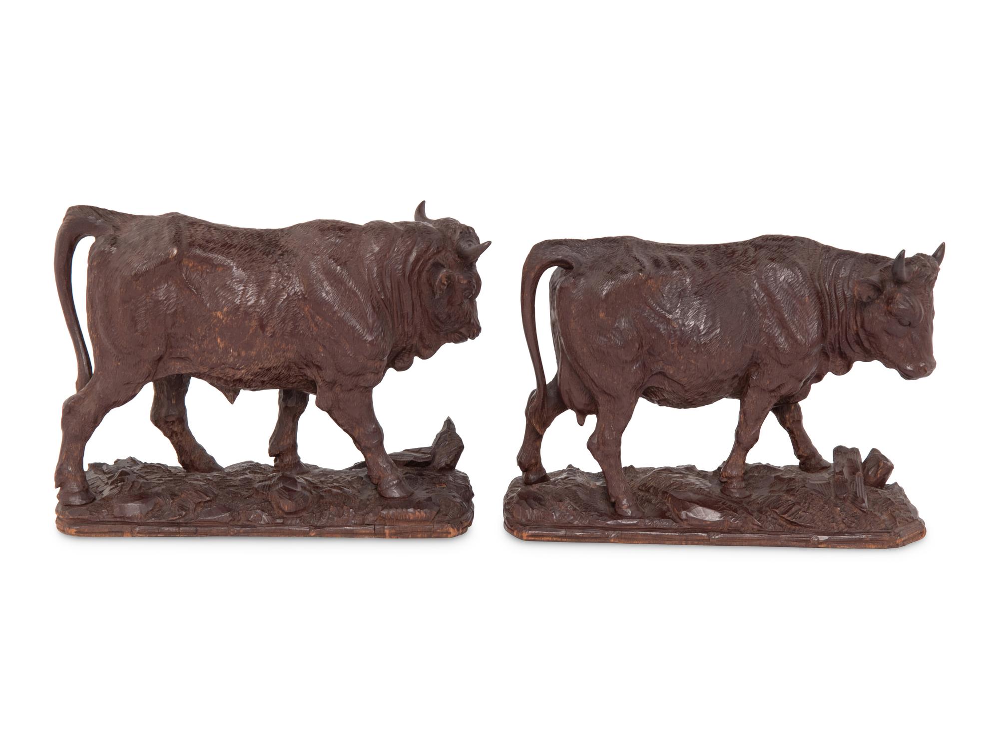 A Pair of Swiss Carved Wood Models of Cattle