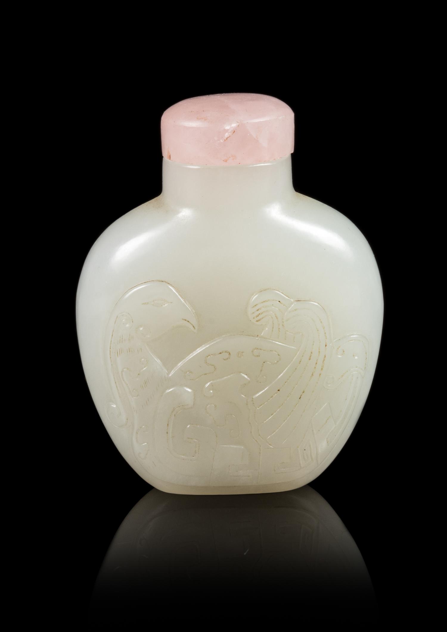 A Carved White Jade Snuff Bottle Height 2 1/2 inches. — 19TH CENTURY