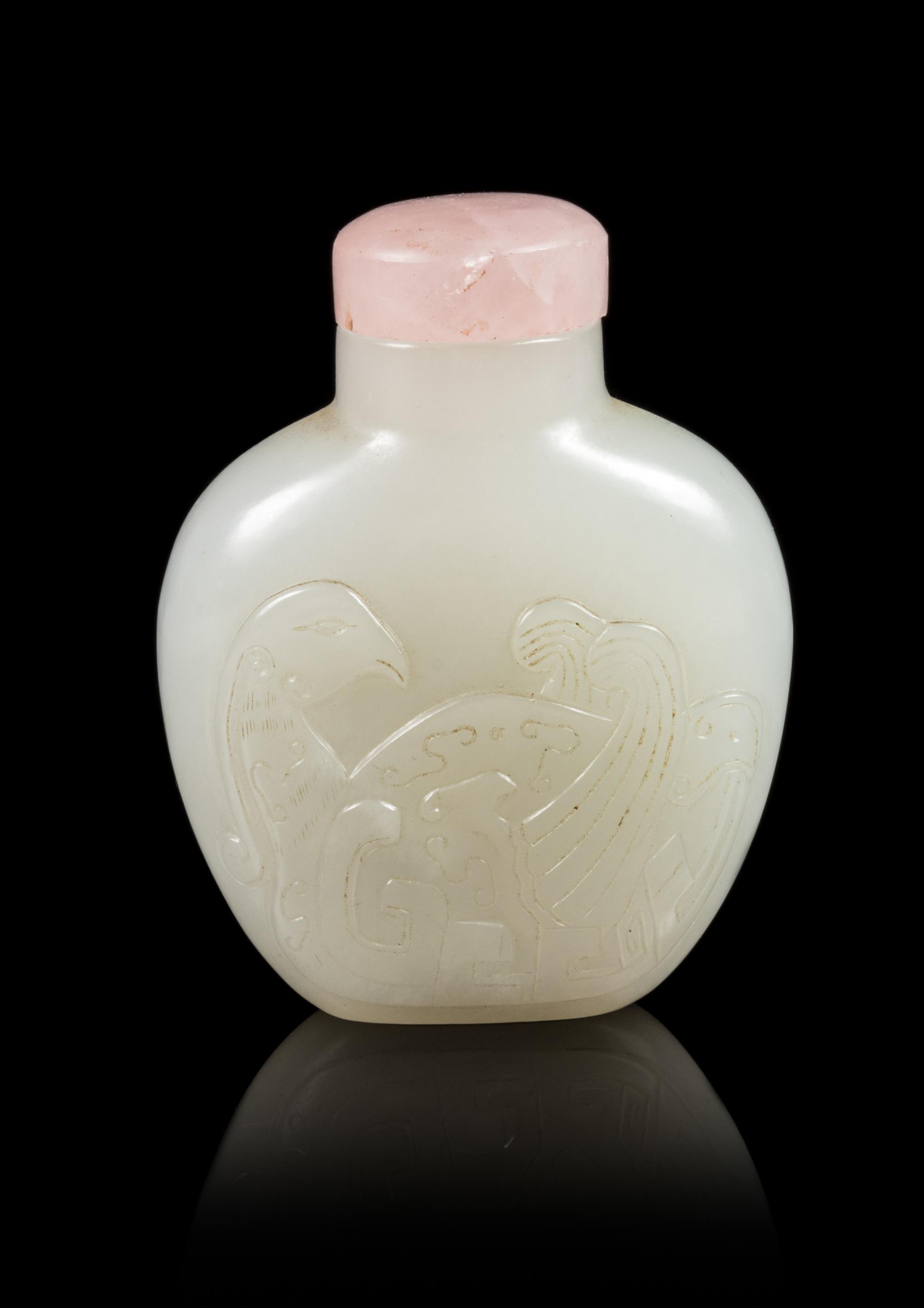 A Carved White Jade Snuff Bottle Height 2 1/2 inches. — 19TH CENTURY