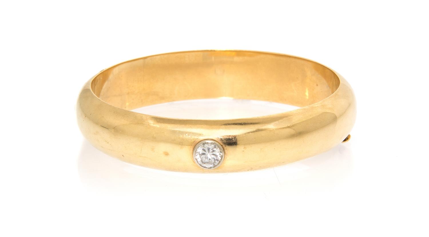A 14 Karat Yellow Gold and Cubic Zirconia Bangle Bracelet, 18.50 dwts.