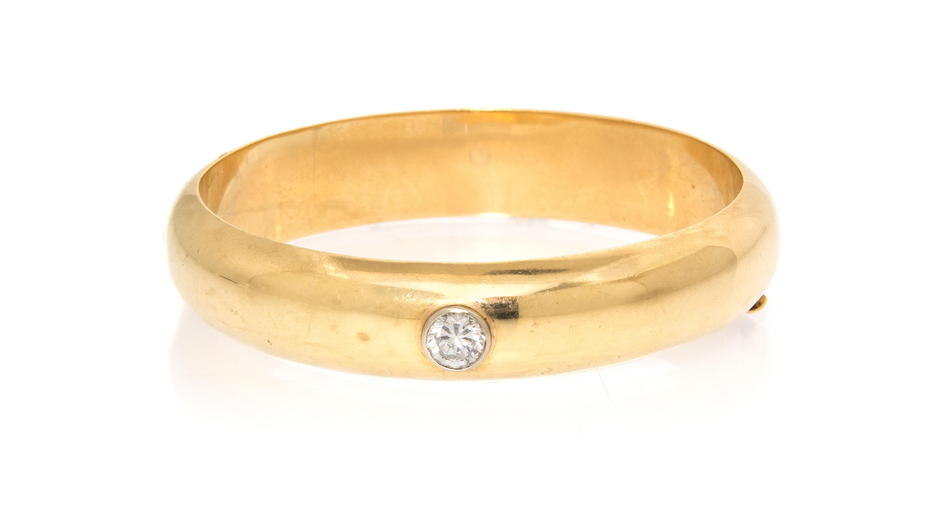 A 14 Karat Yellow Gold and Cubic Zirconia Bangle Bracelet, 18.50 dwts.
