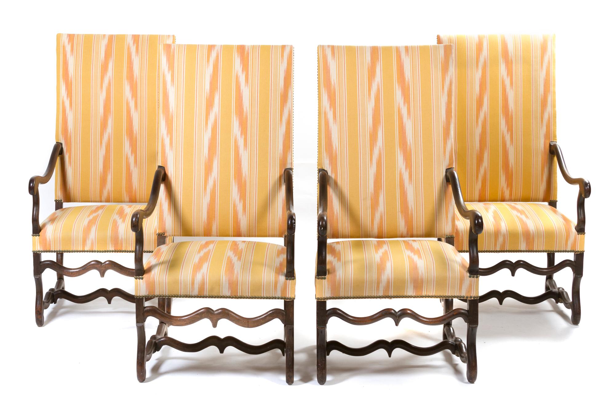 A Set of Four Italian Walnut Open Armchairs, Height 52 inches.