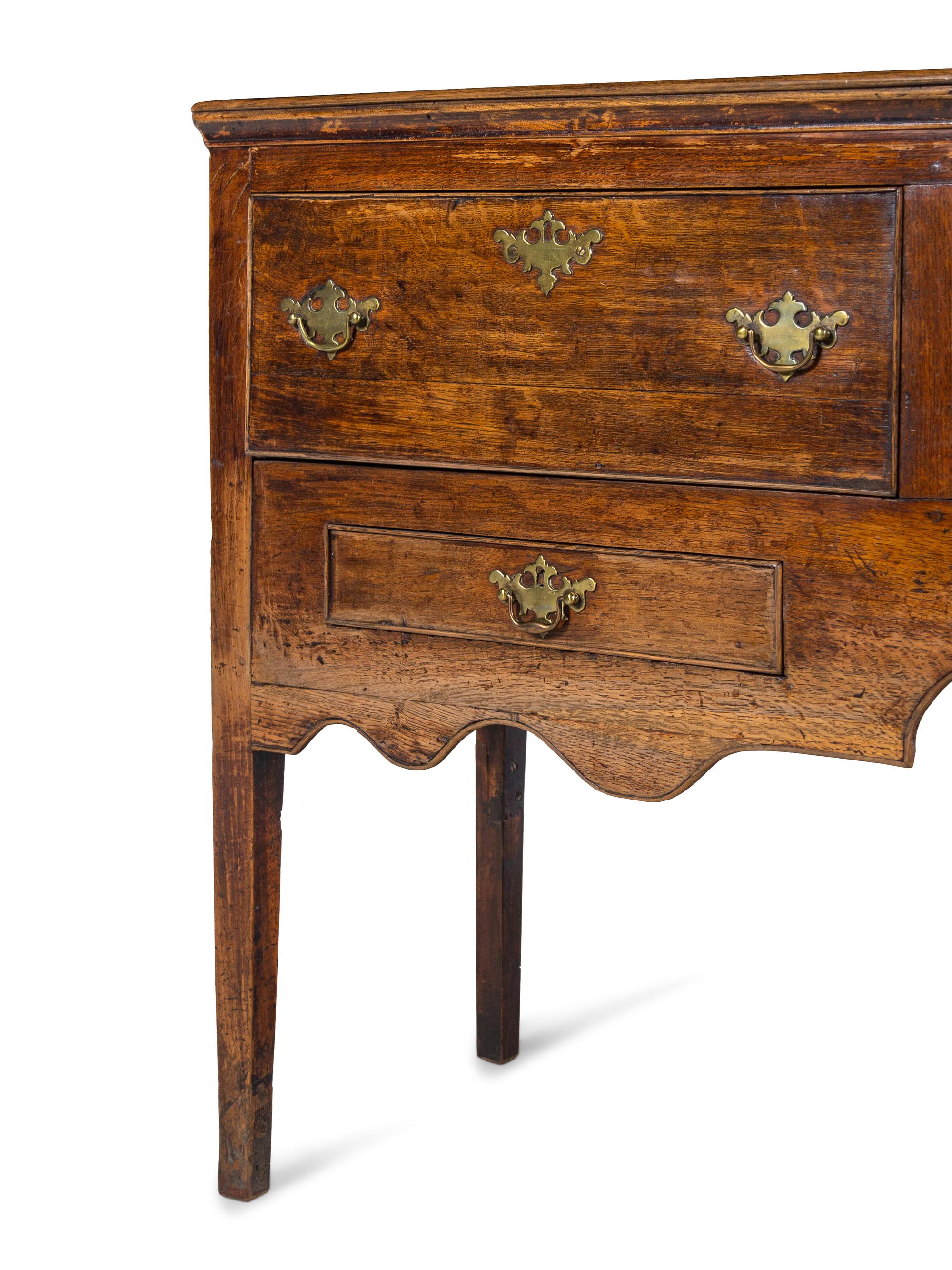 A George III Style Carved Oak Sideboard