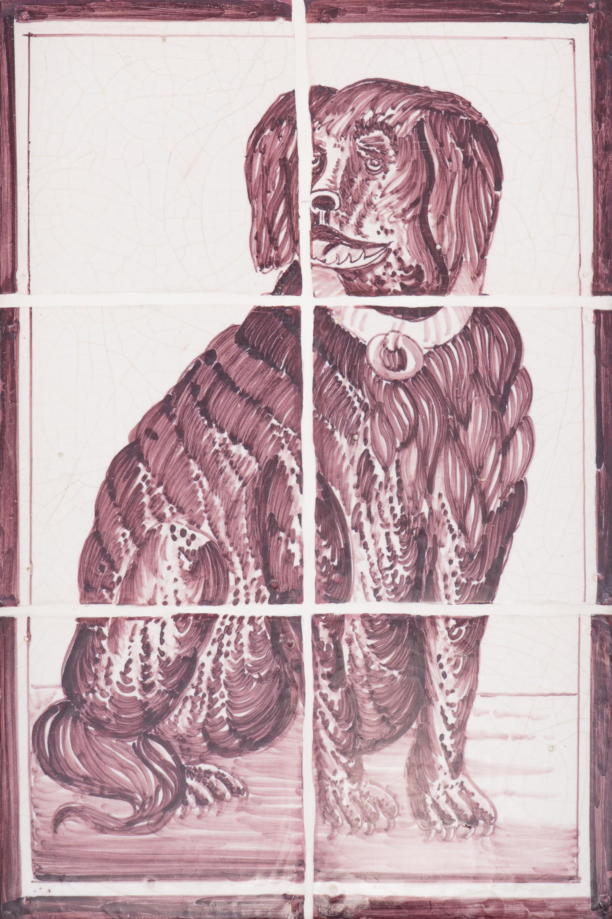 A Pair of Framed White and Sepia Glazed Tile Panels of Dogs