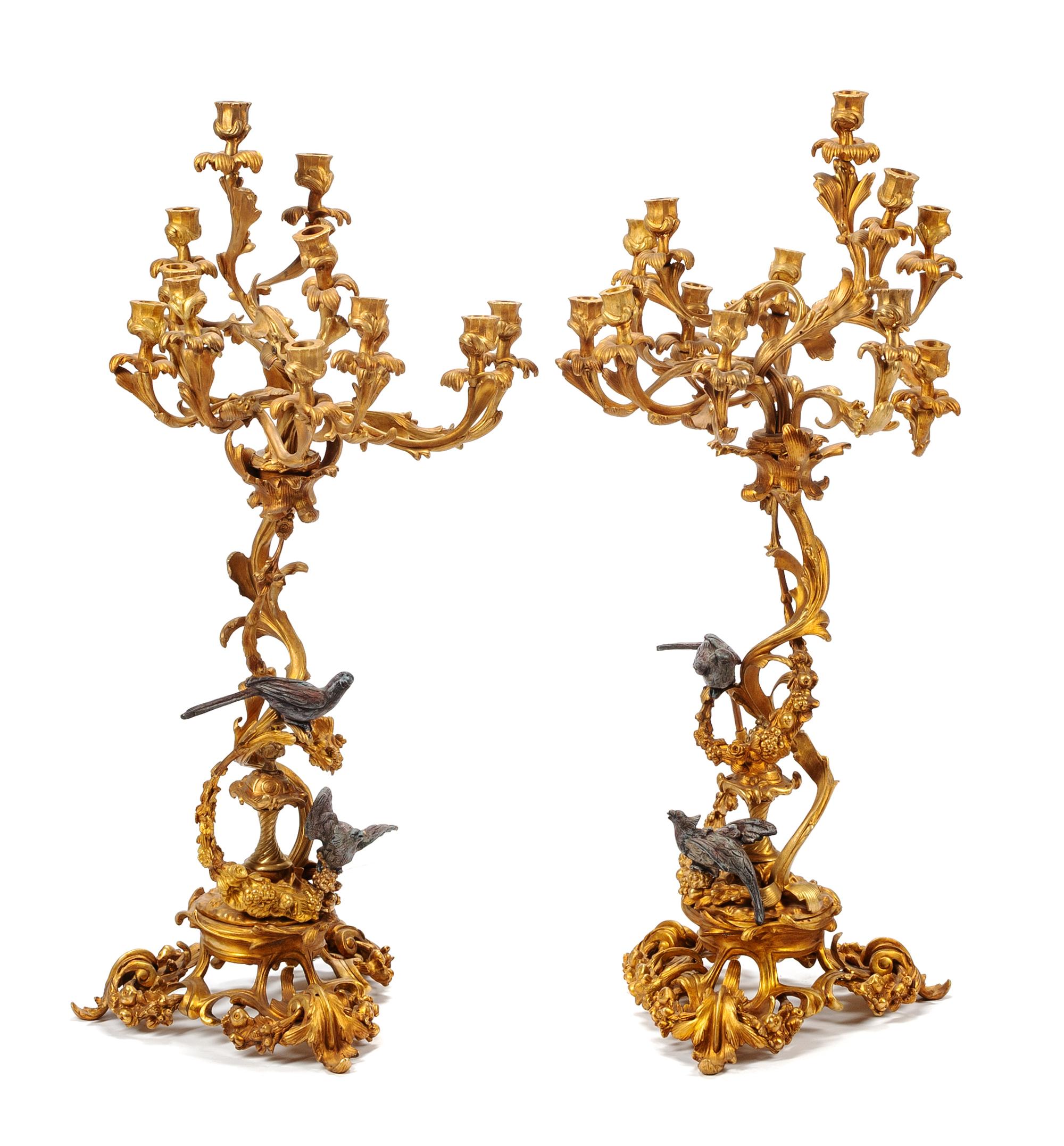 A Pair of Louis XV Style Gilt and Patinated Bronze Twelve-Light Candelabra