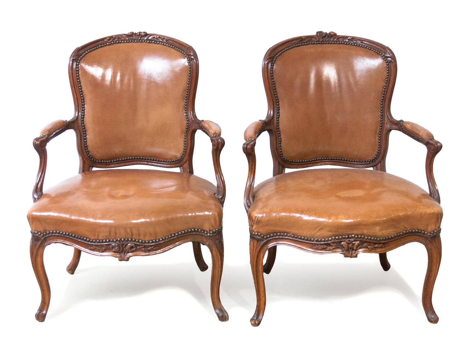 A Pair of Louis XV Style Walnut Fauteuils, Height 34 1/4 inches.