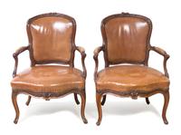 A Pair of Louis XV Style Walnut Fauteuils, Height 34 1/4 inches.