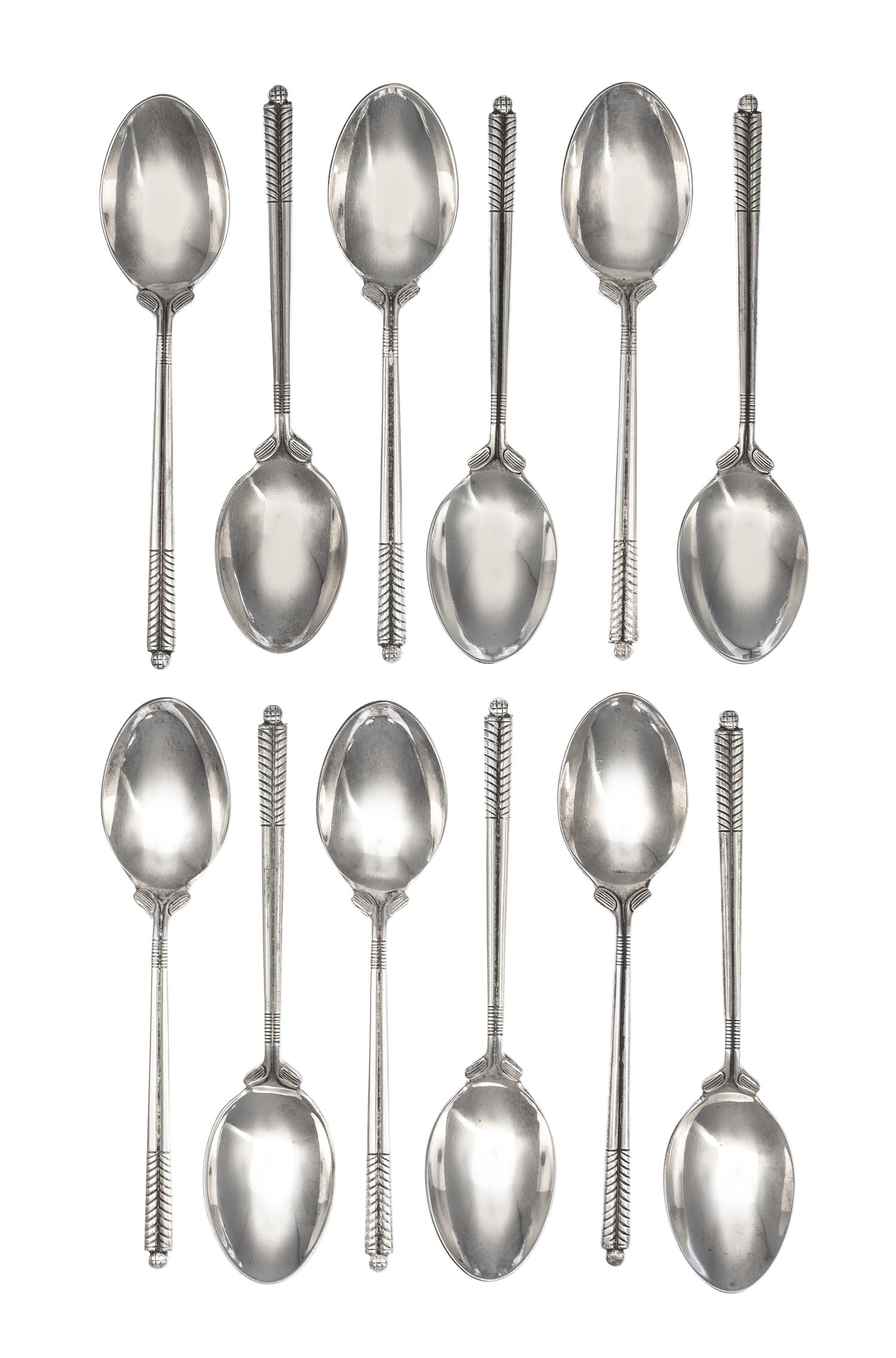 A Set of Twelve English Silver Coffee Spoons, William H. Darby & Co., Birmingham, 1952, each handle in the form of golf clubs with a go