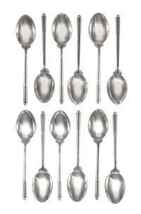 A Set of Twelve English Silver Coffee Spoons, William H. Darby & Co., Birmingham, 1952, each handle in the form of golf clubs with a go