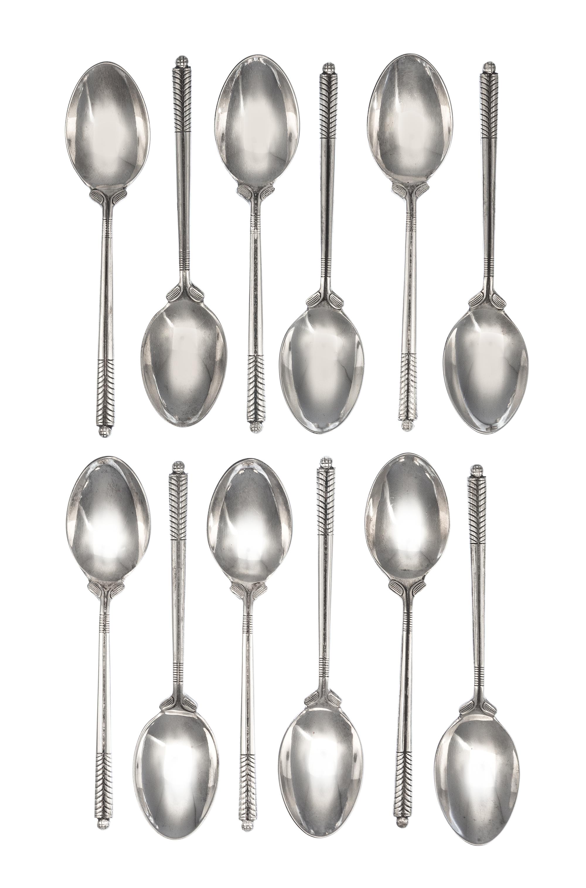 A Set of Twelve English Silver Coffee Spoons, William H. Darby & Co., Birmingham, 1952, each handle in the form of golf clubs with a go