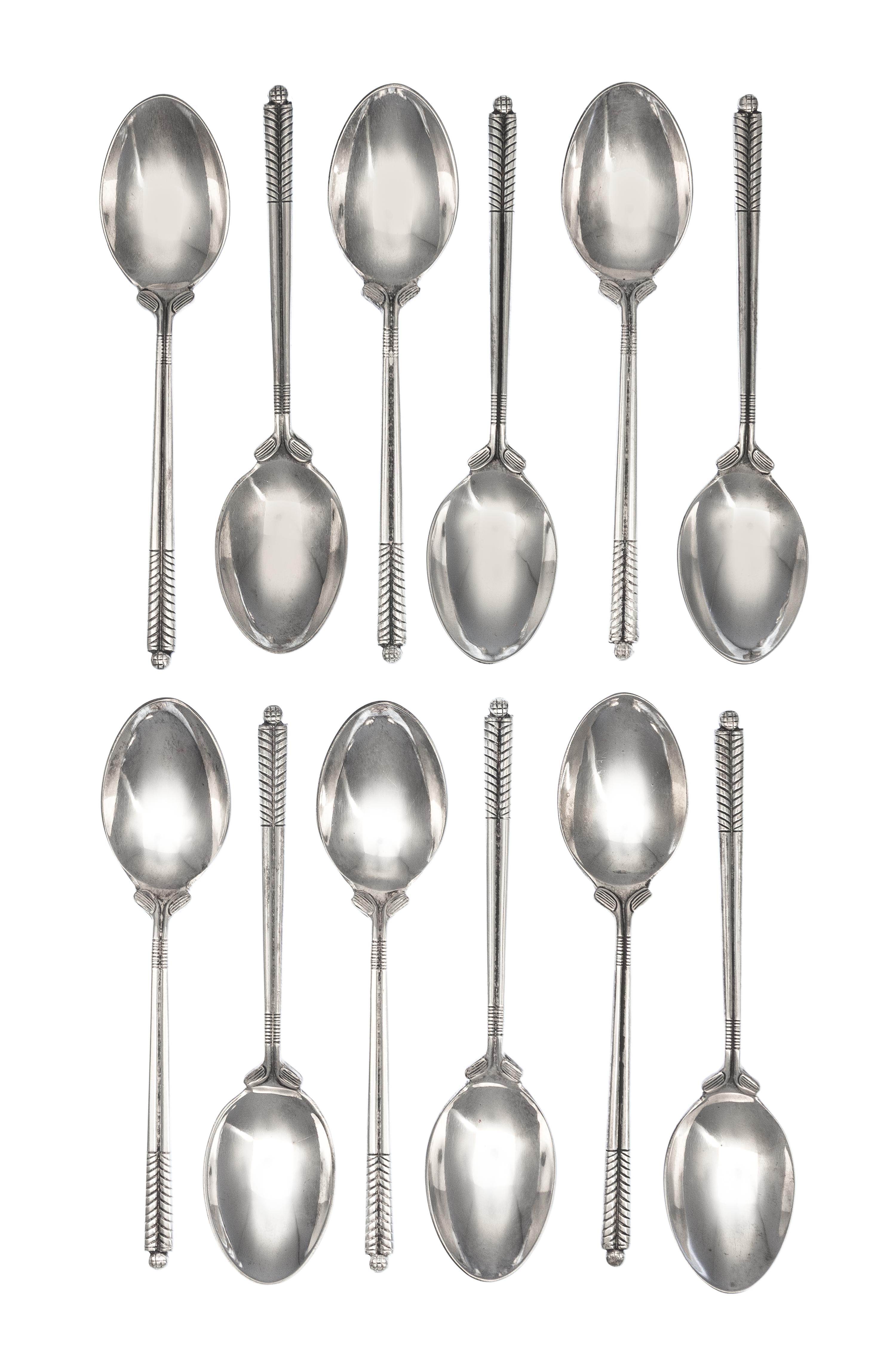 A Set of Twelve English Silver Coffee Spoons, William H. Darby & Co., Birmingham, 1952, each handle in the form of golf clubs with a go