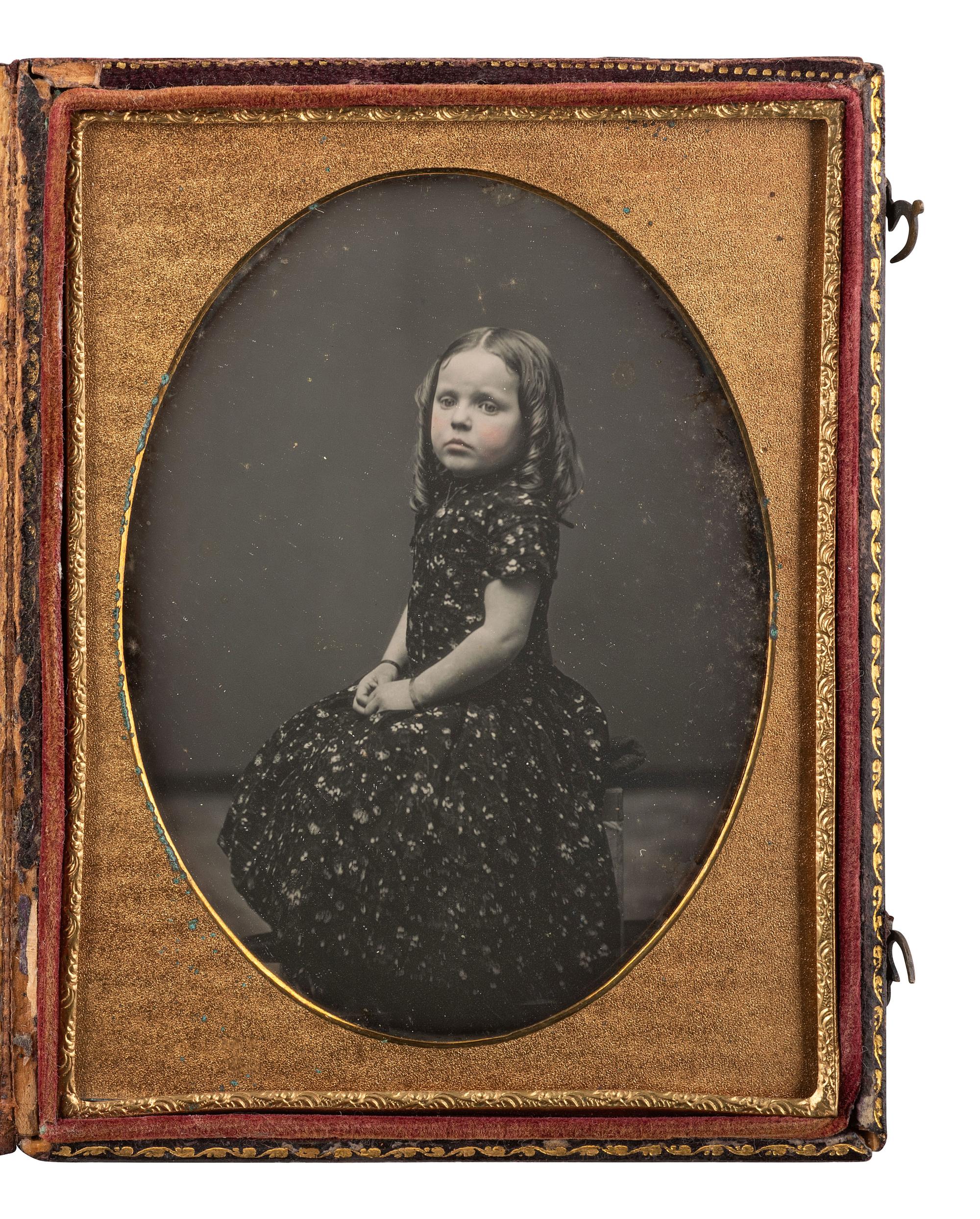 [EARLY PHOTOGRAPHY]. Two quarter plate daguerreotypes of young children posed in studio settings.