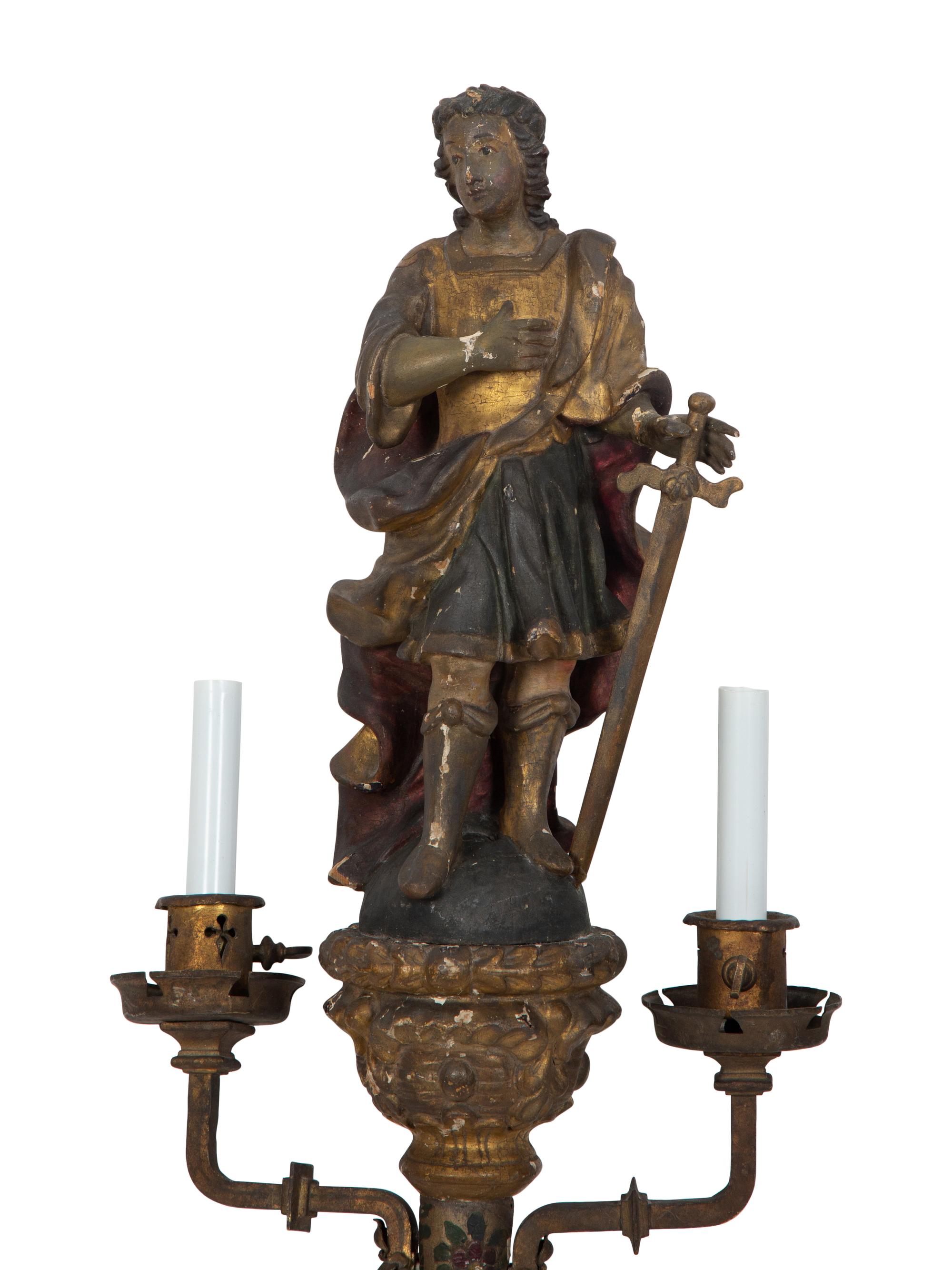 A Near Pair of Italian Carved Wood Figural Two-Light Sconces with Iron Mounts