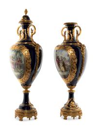 A Pair of Gilt Bronze Mounted Sèvres Style Porcelain Urns