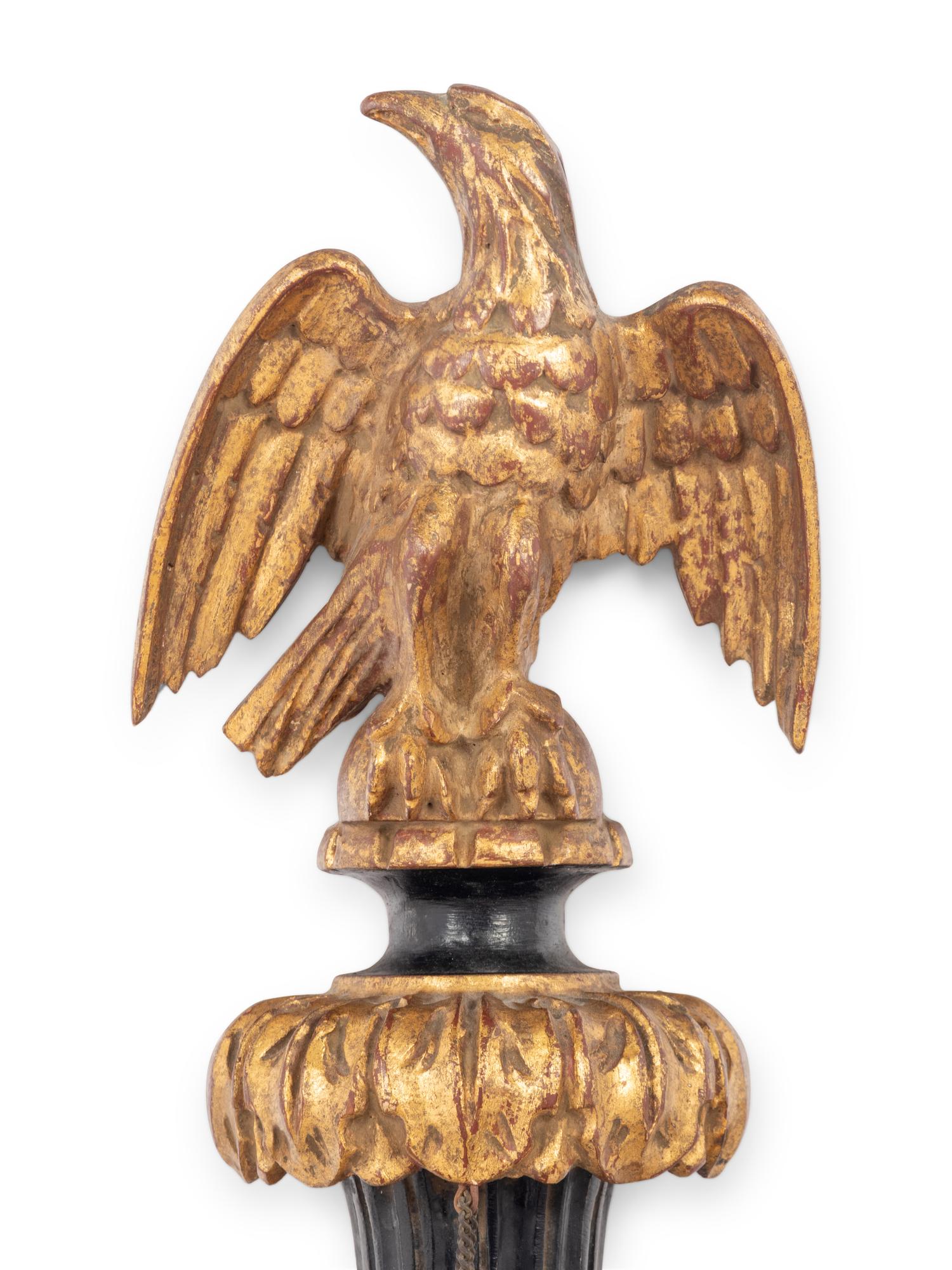 A Pair of Italian Gilt and Ebonized Wood and Tôle Two-Light Sconces