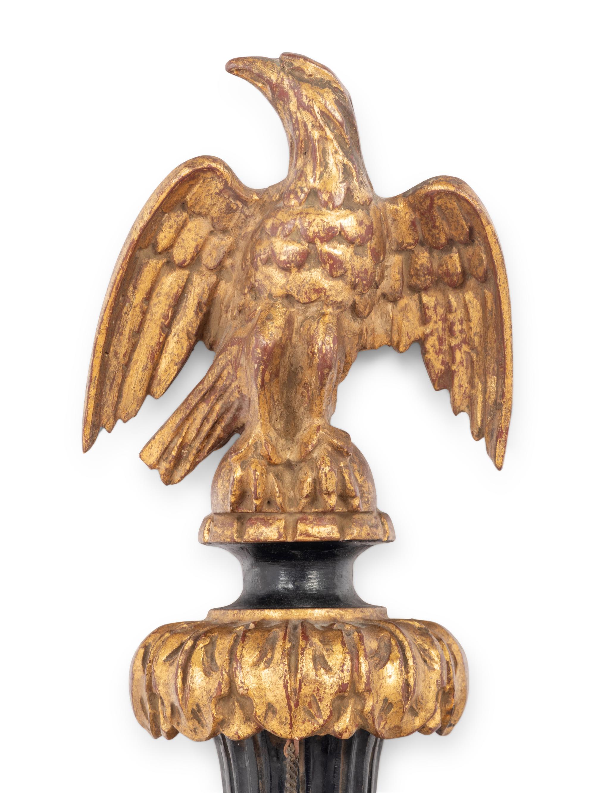 A Pair of Italian Gilt and Ebonized Wood and Tôle Two-Light Sconces