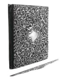 An American Silver Repousse Portfolio, Dominick & Haff, New York, NY, the portfolio cover decorated with rocaille, floral, foliate and
