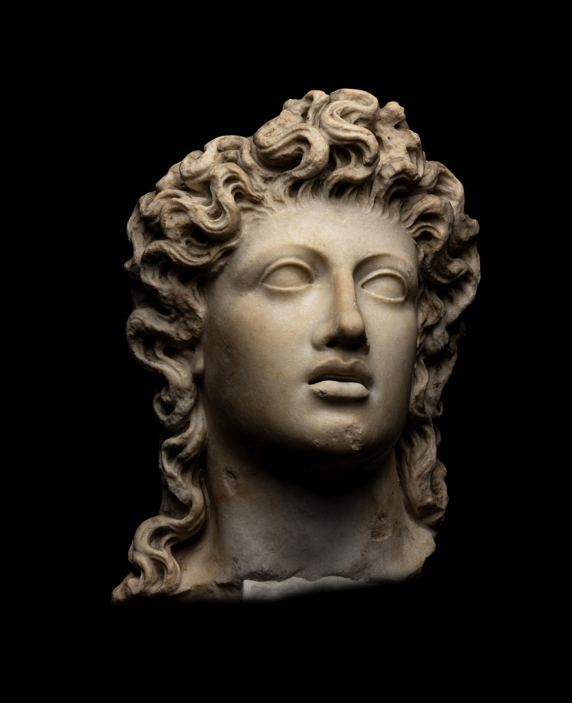 A Roman Marble Head of a Triton